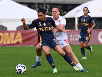 Emma Snerle of A.C.F. Fiorentina and Lucia Di Guglielmo of A.S. Roma Femminile are in action during the 9th day of the Serie A Femminile eBa...