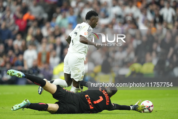 Vinicius Junior left winger of Real Madrid and Brazil scoring his second goal during the La Liga match between Real Madrid CF and CA Osasuna...