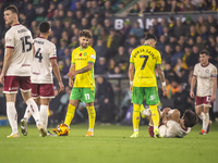 Borja Sainz of Norwich City checks on Yu Hirakawa of Bristol City after a tackle during the Sky Bet Championship match between Norwich City...