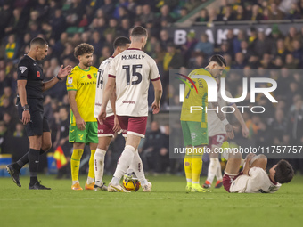 Borja Sainz of Norwich City checks on Yu Hirakawa of Bristol City after a tackle during the Sky Bet Championship match between Norwich City...