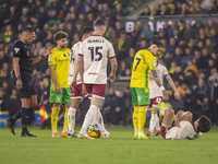 Borja Sainz of Norwich City checks on Yu Hirakawa of Bristol City after a tackle during the Sky Bet Championship match between Norwich City...