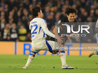 Koki Saito (QPR) is fouled by Ao Tanaka (Leeds United) during the Sky Bet Championship match between Leeds United and Queens Park Rangers at...