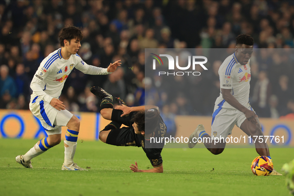 Koki Saito (QPR) is fouled by Ao Tanaka (Leeds United) during the Sky Bet Championship match between Leeds United and Queens Park Rangers at...