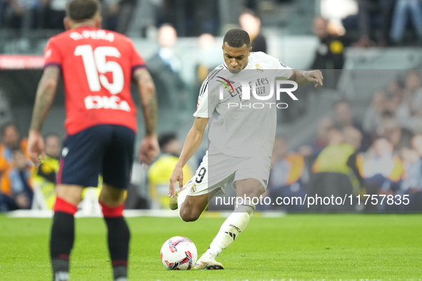 Kylian Mbappe centre-forward of Real Madrid and France shooting to goal during the La Liga match between Real Madrid CF and CA Osasuna at Es...