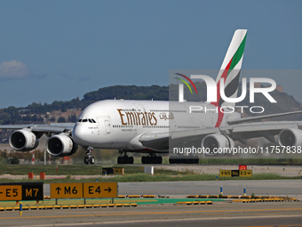 An Airbus A380-861 from Emirates lands at Barcelona airport in Barcelona, Spain, on October 8, 2024. (