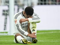 Jude Bellingham central midfield of Real Madrid and England lies injured on the pitch during the La Liga match between Real Madrid CF and CA...