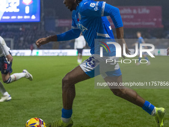 Tayo Adaramola, number 33 of Stockport County F.C., is in possession of the ball during the Sky Bet League 1 match between Stockport County...