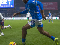 Tayo Adaramola, number 33 of Stockport County F.C., is in possession of the ball during the Sky Bet League 1 match between Stockport County...