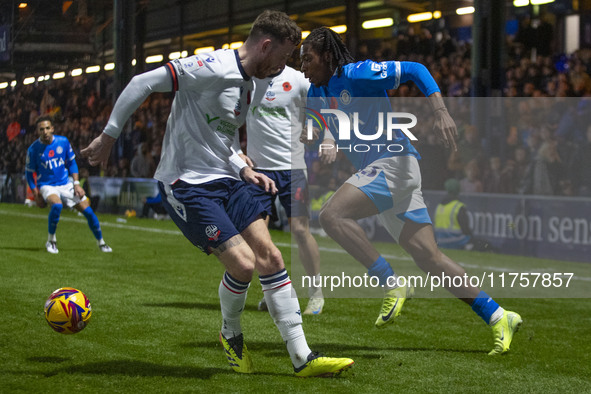 Tayo Adaramola, number 33 of Stockport County F.C., goes past the opponent during the Sky Bet League 1 match between Stockport County and Bo...