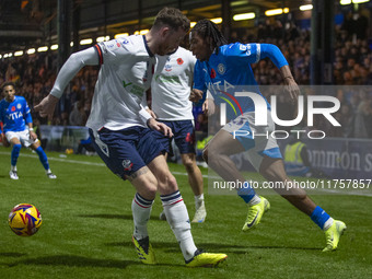 Tayo Adaramola, number 33 of Stockport County F.C., goes past the opponent during the Sky Bet League 1 match between Stockport County and Bo...