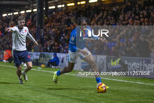 Tayo Adaramola, number 33 of Stockport County F.C., is in possession of the ball during the Sky Bet League 1 match between Stockport County...