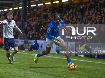 Tayo Adaramola, number 33 of Stockport County F.C., is in possession of the ball during the Sky Bet League 1 match between Stockport County...