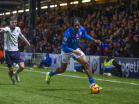 Tayo Adaramola, number 33 of Stockport County F.C., is in possession of the ball during the Sky Bet League 1 match between Stockport County...