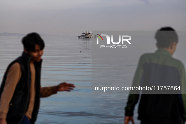 Children play on Caspian Sea Boulevard in Baku, Azerbaijan on November 9, 2024. 