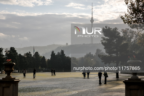 People walk on Caspian Sea Boulevard in Baku, Azerbaijan on November 9, 2024. 