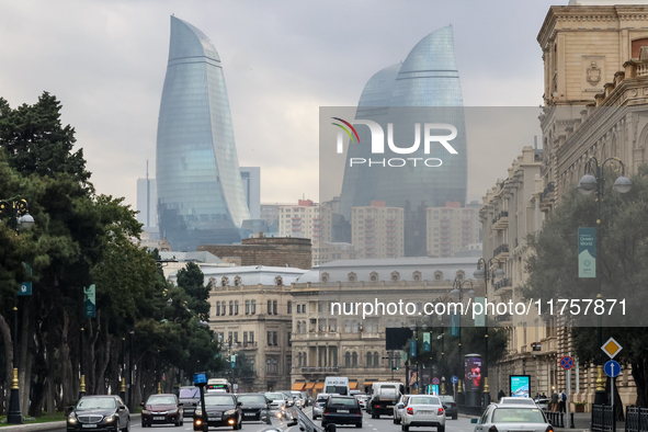 Flame towers are seen from a distance with older part of city in front in Baku, Azerbaijan on November 9, 2024. 