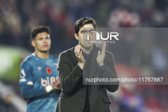 Andoni Iraola, manager of Bournemouth, thanks the traveling support during the Premier League match between Brentford and Bournemouth at the...