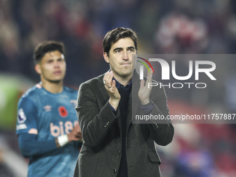 Andoni Iraola, manager of Bournemouth, thanks the traveling support during the Premier League match between Brentford and Bournemouth at the...