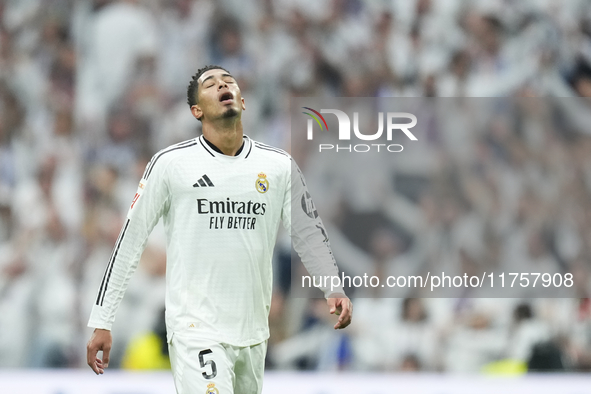 Jude Bellingham central midfield of Real Madrid and England celebrates after scoring his sides first goal during the La Liga match between R...