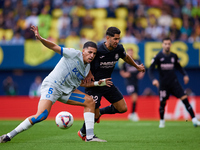 Ayoze (R) of Villarreal CF competes for the ball with Abdelkabir Abqar of Deportivo Alaves during the LaLiga EA Sports match between Villarr...