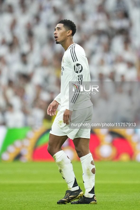 Jude Bellingham central midfield of Real Madrid and England celebrates after scoring his sides first goal during the La Liga match between R...