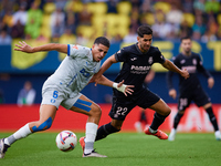 Ayoze (R) of Villarreal CF competes for the ball with Abdelkabir Abqar of Deportivo Alaves during the LaLiga EA Sports match between Villarr...