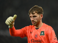 Daniel Grimshaw of Plymouth Argyle participates in the Sky Bet Championship match between Derby County and Plymouth Argyle at Pride Park in...