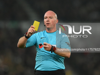 Referee Simon Hooper produces a yellow card during the Sky Bet Championship match between Derby County and Plymouth Argyle at Pride Park in...