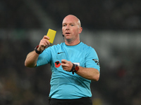 Referee Simon Hooper produces a yellow card during the Sky Bet Championship match between Derby County and Plymouth Argyle at Pride Park in...