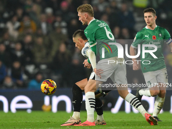 Jerry Yates of Derby County shields the ball from Kornel Szucs of Plymouth Argyle during the Sky Bet Championship match between Derby County...