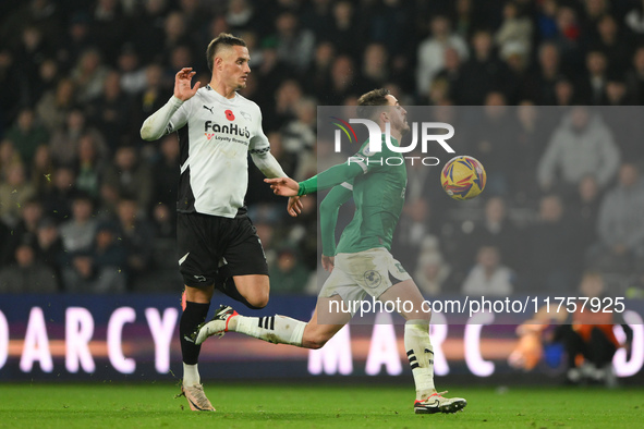 Julio Pleguezuelo of Plymouth Argyle is under pressure from Jerry Yates of Derby County during the Sky Bet Championship match between Derby...