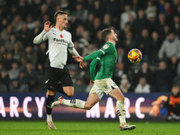 Julio Pleguezuelo of Plymouth Argyle is under pressure from Jerry Yates of Derby County during the Sky Bet Championship match between Derby...