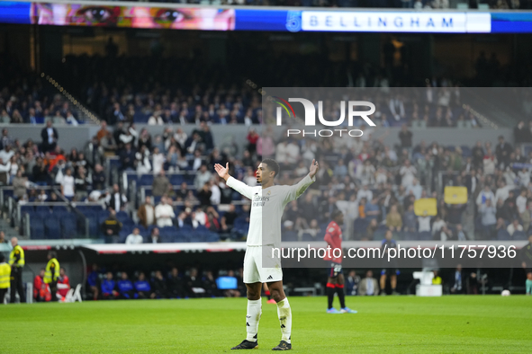 Jude Bellingham central midfield of Real Madrid and England celebrates after scoring his sides first goal during the La Liga match between R...