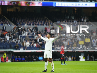 Jude Bellingham central midfield of Real Madrid and England celebrates after scoring his sides first goal during the La Liga match between R...