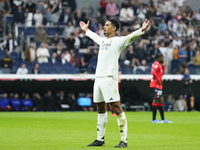 Jude Bellingham central midfield of Real Madrid and England celebrates after scoring his sides first goal during the La Liga match between R...