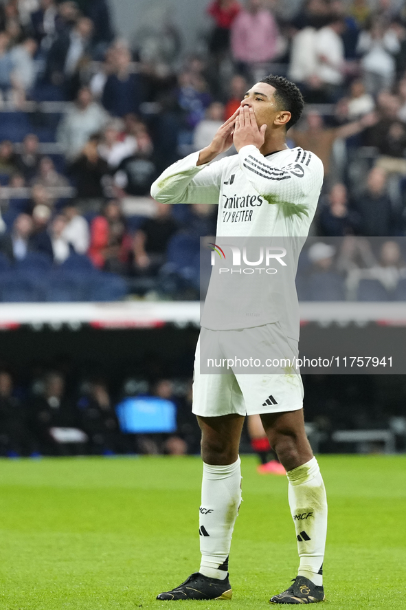 Jude Bellingham central midfield of Real Madrid and England celebrates after scoring his sides first goal during the La Liga match between R...