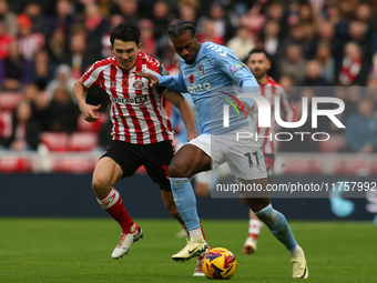 Coventry City's Haji Wright holds off Sunderland's Luke O'Nien during the Sky Bet Championship match between Sunderland and Coventry City at...