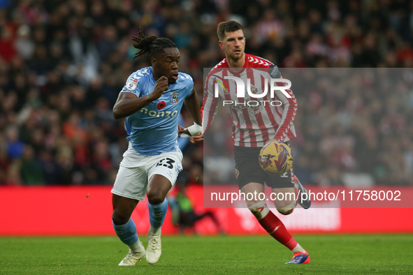 Sunderland's Chris Mepham holds off Coventry City's Brandon Thomas-Asante during the Sky Bet Championship match between Sunderland and Coven...