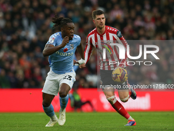 Sunderland's Chris Mepham holds off Coventry City's Brandon Thomas-Asante during the Sky Bet Championship match between Sunderland and Coven...