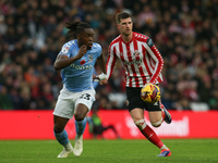 Sunderland's Chris Mepham holds off Coventry City's Brandon Thomas-Asante during the Sky Bet Championship match between Sunderland and Coven...