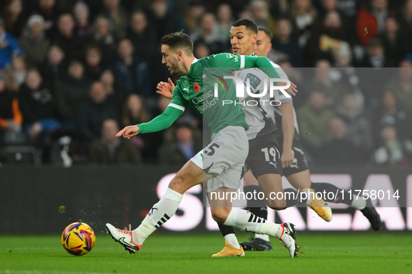 Julio Pleguezuelo of Plymouth Argyle is under pressure from Kayden Jackson of Derby County during the Sky Bet Championship match between Der...