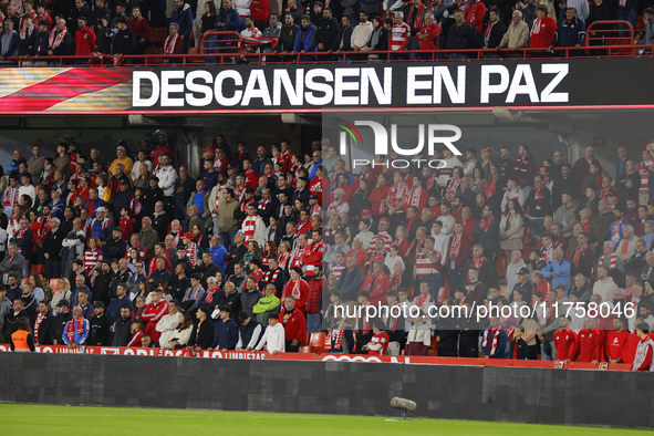 Fans honor Valencia inhabitants after the floods due to a DANA storm on October 29 during the LaLiga Hypermotion match between Granada CF an...