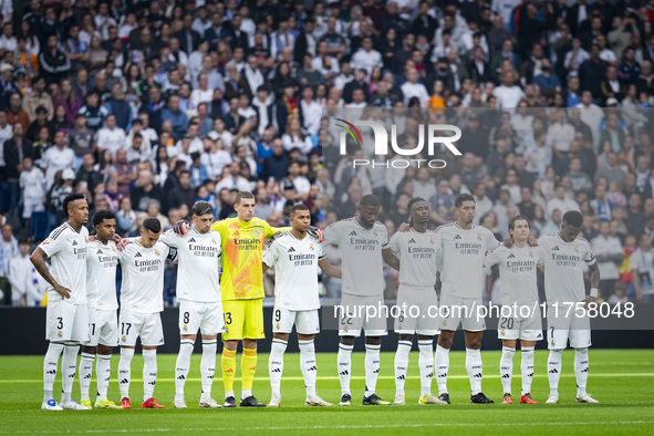 Real Madrid players observe a minute of silence in memory of the victims of the recent floods in Valencia during the La Liga EA Sports 2024/...