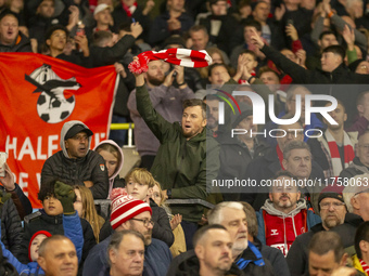 Bristol City supporters celebrate after the Sky Bet Championship match between Norwich City and Bristol City at Carrow Road in Norwich, Engl...