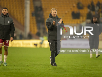 Bristol City Manager, Liam Manning, applauds their supporters after the Sky Bet Championship match between Norwich City and Bristol City at...