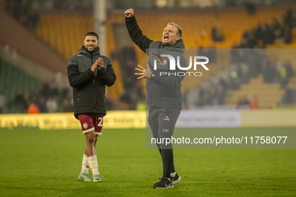 Bristol City Manager, Liam Manning, celebrates their win after the Sky Bet Championship match between Norwich City and Bristol City at Carro...