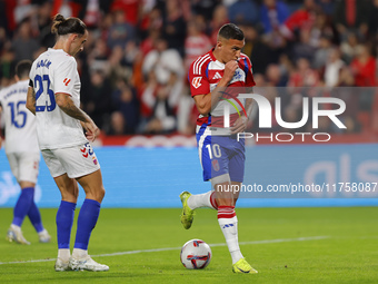 Myrto Uzuni of Granada CF scores the first goal of the match from the penalty during the LaLiga Hypermotion match between Granada CF and CD...