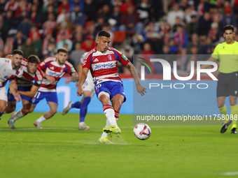 Myrto Uzuni of Granada CF scores the first goal of the match from the penalty during the LaLiga Hypermotion match between Granada CF and CD...