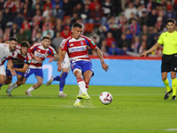 Myrto Uzuni of Granada CF scores the first goal of the match from the penalty during the LaLiga Hypermotion match between Granada CF and CD...