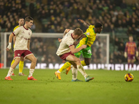 Forson Amankwah of Norwich City is tackled by Max Bird of Bristol City during the Sky Bet Championship match between Norwich City and Bristo...